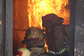 Firefighters training on a live fire Firefighters training on a live fire
