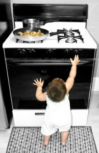 Baby reaching for stove